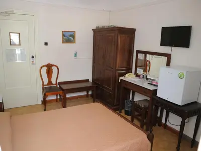 a room with a desk and a computer and a deskictericter at Acropolis House Hotel Classic in Athens