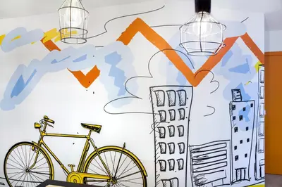 a drawing of a bike and a building at The Athenians Modern Apartments in Athens