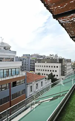 a view of the city from the roof of a building at The Athenians Modern Apartments in Athens