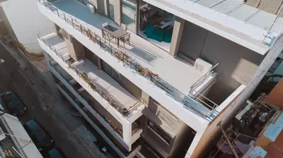 an overhead view of a building with a swimming pool at Elysium Boutique Apartments in Athens