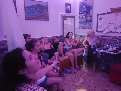 a group of people sitting on a couch at Pagration Youth Hostel in Athens