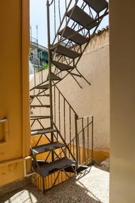 a set of stairs next to a building at Central 2-Bedroom Apartment with Rooftop Access! EP9G in Athens