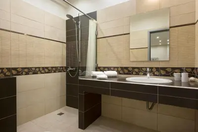 a bathroom with a sink and a mirror at Apartment at Koukaki, 150m from the metro by YHA in Athens