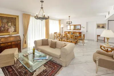 a living room with a couch and a table at Nice Sea View Elegant Apartment in Athens