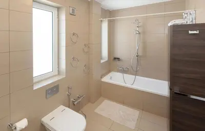 a bathroom with a toilet and a shower and a sink at Nice Sea View Elegant Apartment in Athens