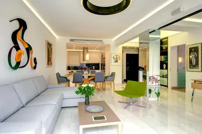 a living room with a couch and a table at Frixos Acropolis Luxury Apartment in Athens