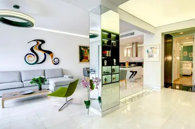 a living room with a couch and a table at Frixos Acropolis Luxury Apartment in Athens