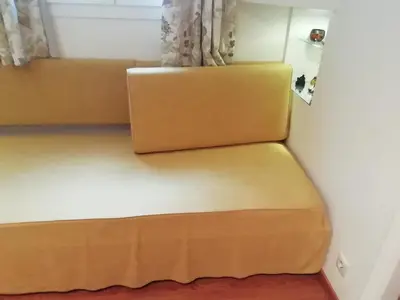 two beds in a small room with a window at Be My Guest Apartment in Athens