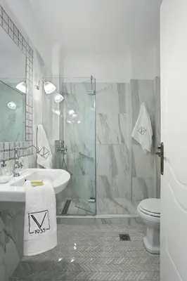 a bathroom with a shower and a sink and a toilet at V1935 Luxurious Apartments in Athens