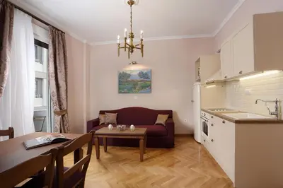 a living room with a couch and a table at V1935 Luxurious Apartments in Athens