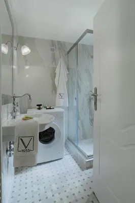a bathroom with a toilet and a sink and a shower at V1935 Luxurious Apartments in Athens