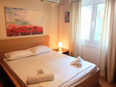 a bedroom with a bed with towels on it at Elegant apartment in Acropolis with roof garden in Athens