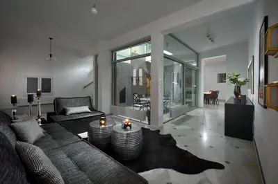 a living room with a couch and a table at ALDIS MANSION by K&K in Athens