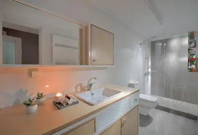 a bathroom with a sink and a toilet at ALDIS MANSION by K&K in Athens