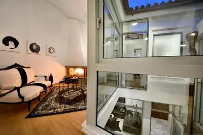 a view of a living room with a large window at ALDIS MANSION by K&K in Athens