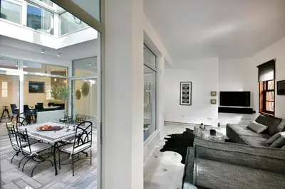 a living room with a couch and a table at ALDIS MANSION by K&K in Athens