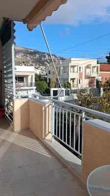 a balcony with a view of a city at DaMa Blue in Saronida