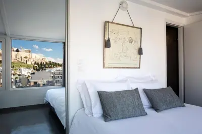 a bedroom with a white bed and a window at Bright Apartment with Stunning Acropolis Views! SG5 in Athens