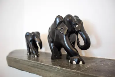 a statue of two elephants on a wooden shelf at Bright Apartment with Stunning Acropolis Views! SG5 in Athens