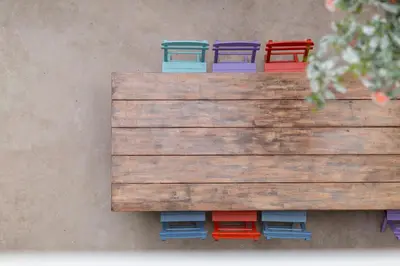 a wooden box with four colorful containers on it at Nubian Hostel in Athens