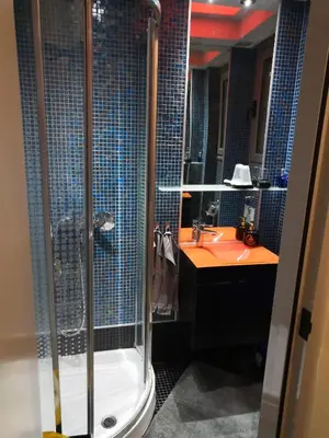 a bathroom with a shower and a sink at Barbara's appartment in Athens