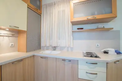a kitchen with a sink and a counter top at Acropolis at your fingertips in Athens