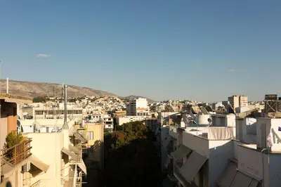 a view of a city with buildings at Acropolis at your fingertips in Athens