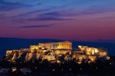 a view of the acropolis at night at Deluxe Apartment in Vouliagmeni in Athens