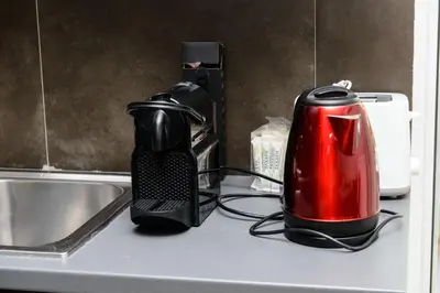 a toaster sitting on a counter next to a sink at Apartment & Parking 100m Kerameikos Metro in Athens