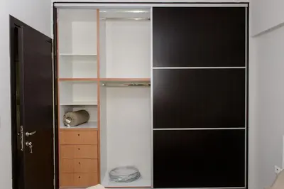 a closet with black and white shelving at Apartment & Parking 100m Kerameikos Metro in Athens