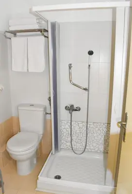 a bathroom with a toilet and a shower at Acqua Marina - Άκουα Μαρίνα in Agia Marina Aegina