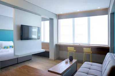 a living room with a couch and a tv at Athenaeum K 29 in Athens