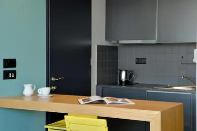 a kitchen with a table with a book on it at Athenaeum K 29 in Athens