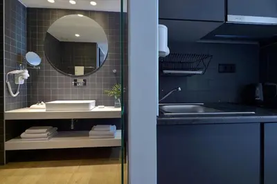 a bathroom with a sink and a mirror at Athenaeum K 29 in Athens