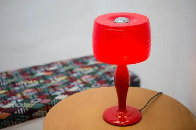 a red lamp sitting on top of a table at Vol.5 in Athens
