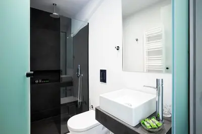 a bathroom with a white sink and a toilet at Vol.5 in Athens