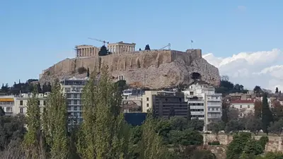 a building on top of a mountain at Acropolis View apartment 120sqm in Athens
