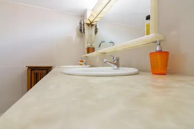 a bathroom with two sinks on a counter at Acropolis View apartment 120sqm in Athens