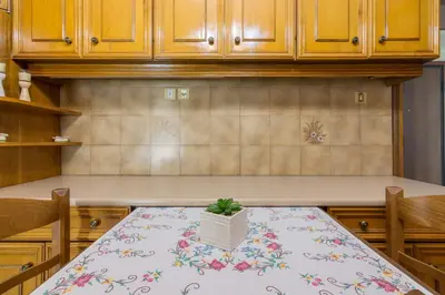 a kitchen with a table with a potted plant on it at Acropolis View apartment 120sqm in Athens