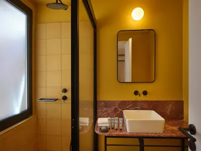 a bathroom with a sink and a shower at Astikon House in Athens