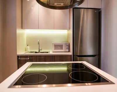 a kitchen with a sink and a refrigerator at Elegant House Under Acropolis in Athens