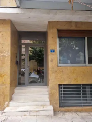 a facade of a building with a window and stairs at Elegant House Under Acropolis in Athens
