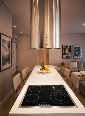 a kitchen and dining room with a table with a stove at Elegant House Under Acropolis in Athens