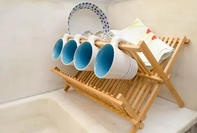 a rack with cups and a tub in a bathroom at Home Sweet Home in Athens