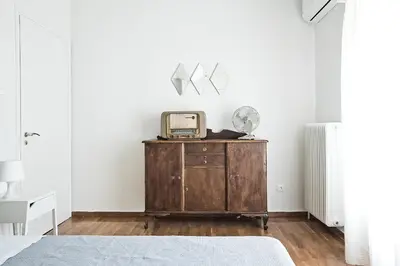 a bedroom with a dresser with a radio on it at Home Sweet Home in Athens
