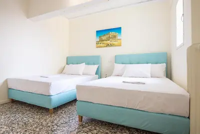 two beds sitting next to each other in a room at Acropolis View Paradise Apartments in Athens