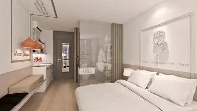 a white bedroom with a large bed and a desk at Great Living Apartments in Athens