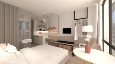 a white living room with a white bed and a table at Great Living Apartments in Athens