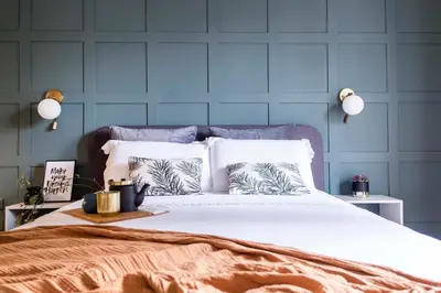 a blue bedroom with a large bed with white pillows at Agora Vista Acropolis in Athens