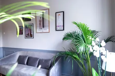 a living room with a couch and some pictures on the wall at Agora Vista Acropolis in Athens